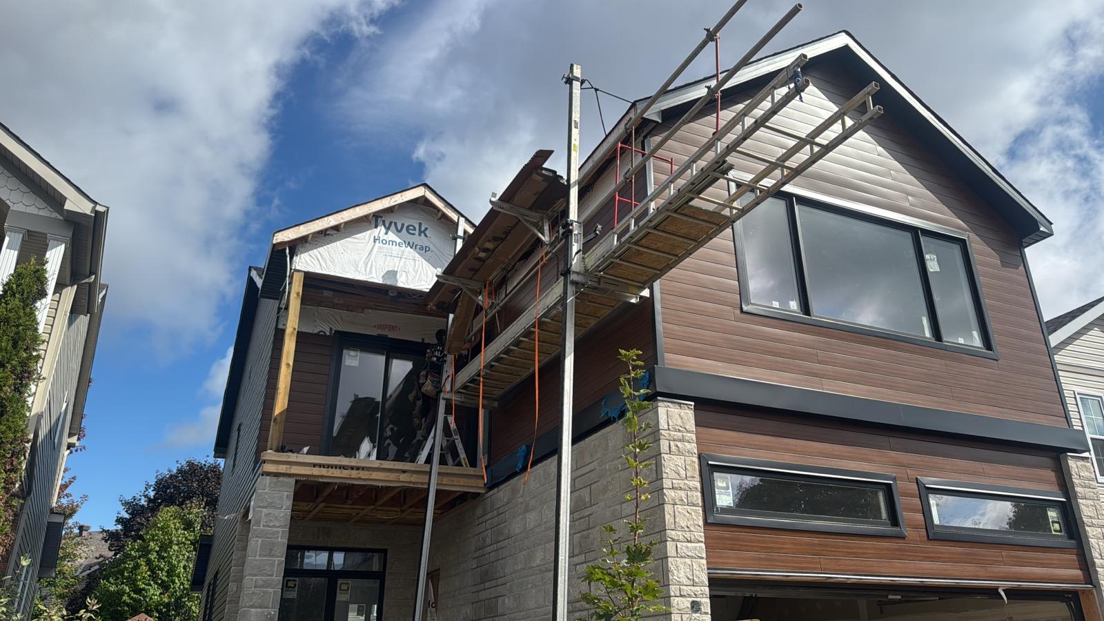 Same home after stone, siding, and window install