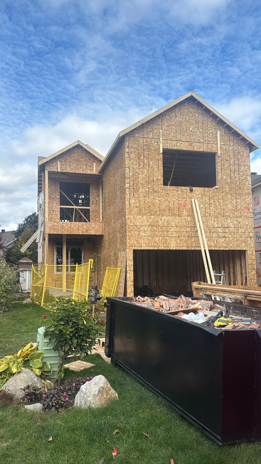 Home during exterior demolition with OSB sheathing